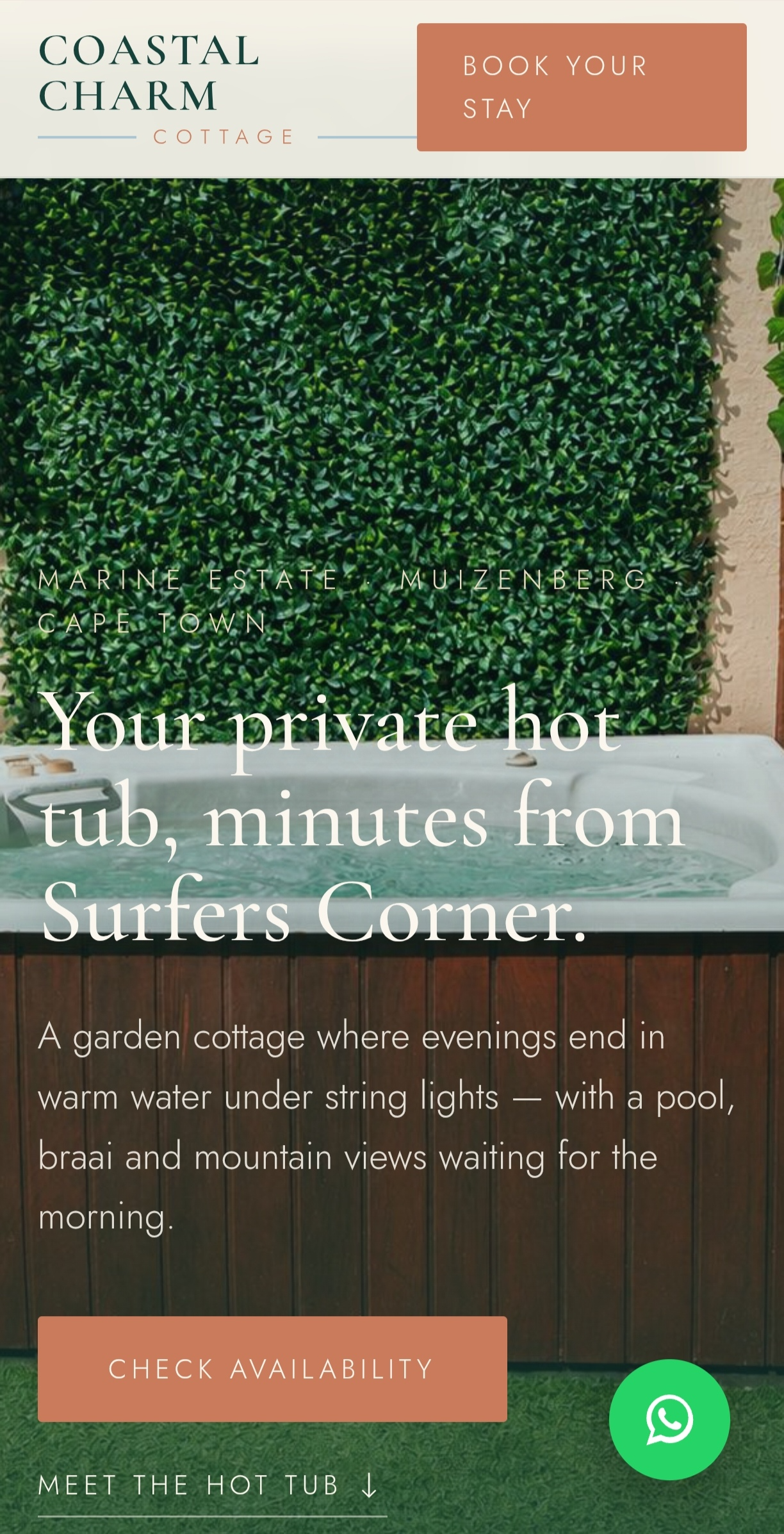 Coastal Charm Cottage website shown on a mobile phone, designed by SAGE